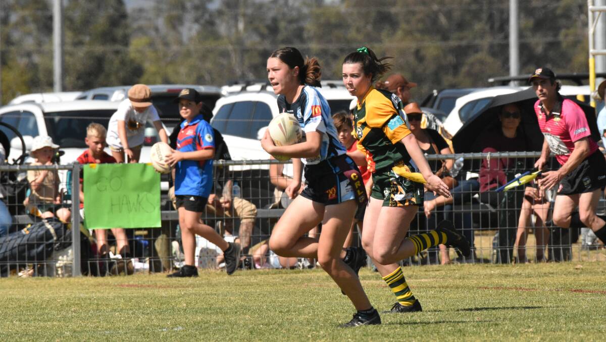 Maia Marino sprints to make a try for the Breakers. 