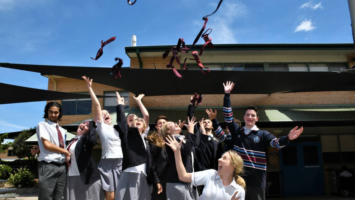 What a relief: Students from St Columba Anglican College celebrate at the end of the last exam. Photo: Matt Attard