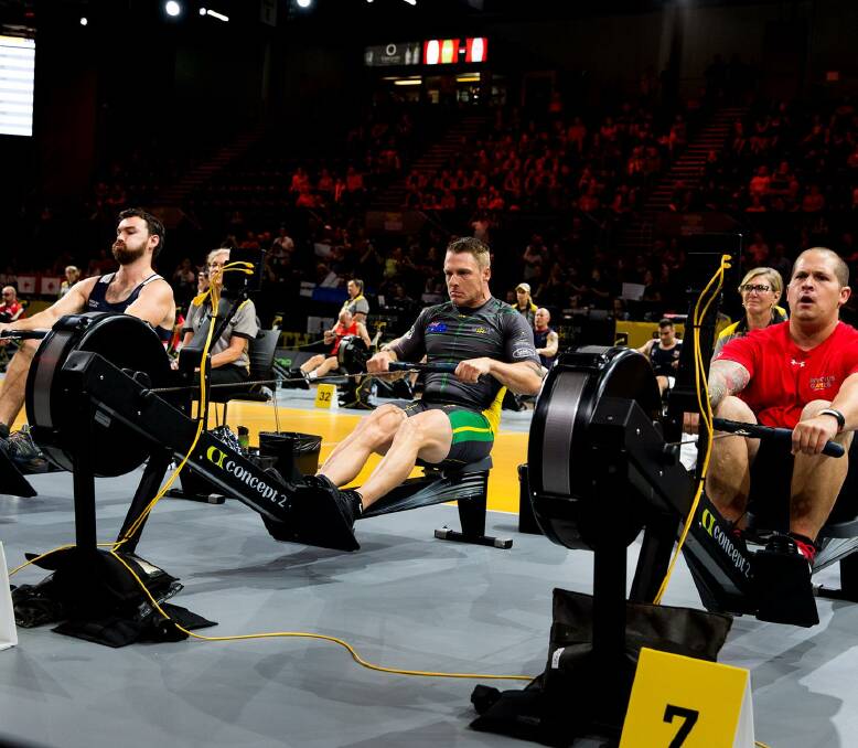 Strong effort: Matt Model (centre)competes in the indoor rowing event. Photo: Invictus Games: Team Australia, Facebook.
