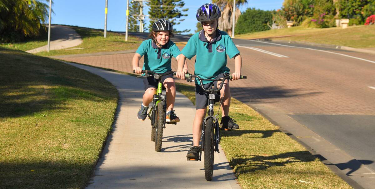 Happy kids: Harry and Connor Lawrence will be able to ride on footpaths safely for many years to come. Photo: Ivan Sajko
