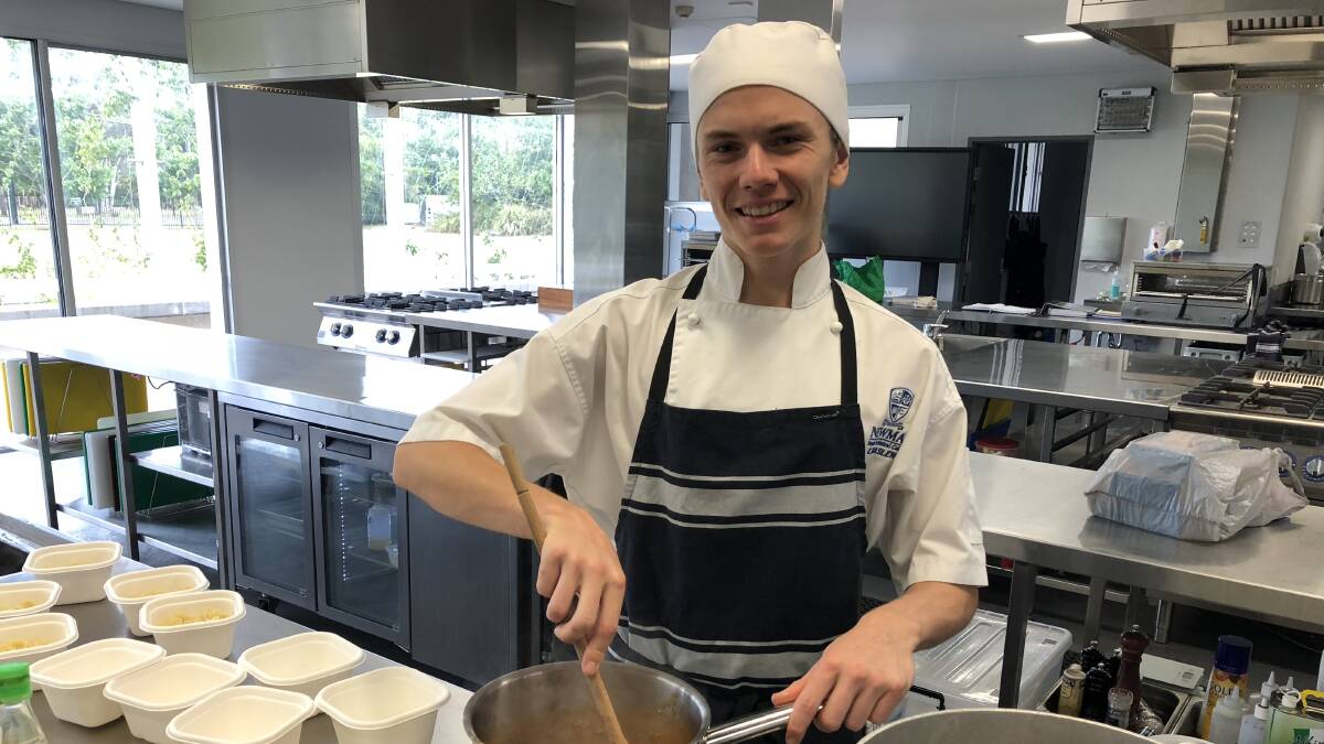 Talent aplenty: Kyle Maslen cooking in the Newman kitchen as an apprentice chef.