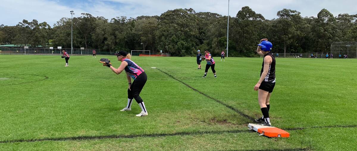 Great conditions: Bec Elford on first base, with Lakers player Lisa Muller. Photo: supplied
