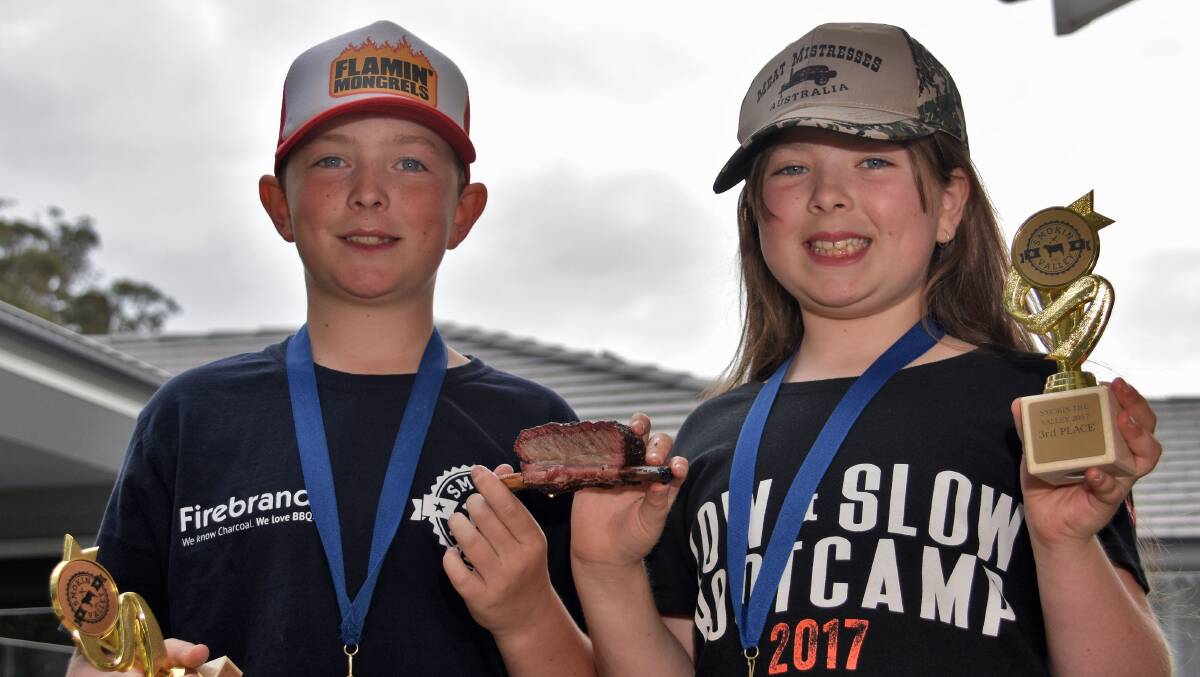 Barbecue king and queen: Pitmasters Jackson and Paige Roberts with their trophies and medals. Photo: Matt Attard