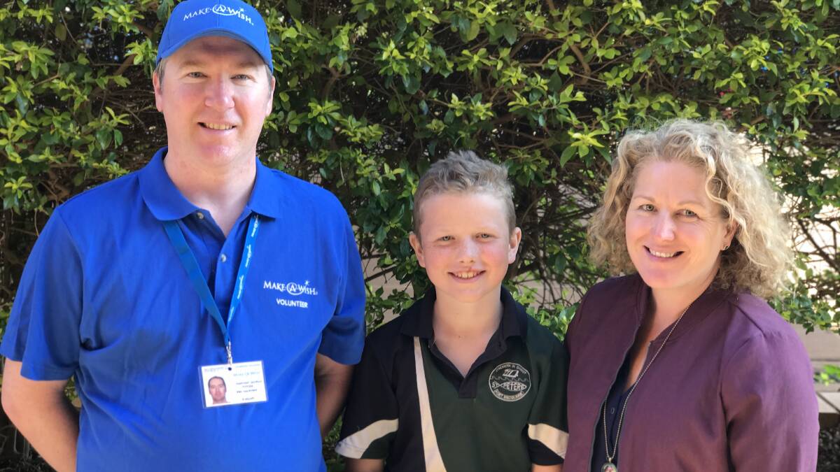 Port Macquarie Make A Wish volunteer Jonathan Sampson with Max and Kristy Robb.