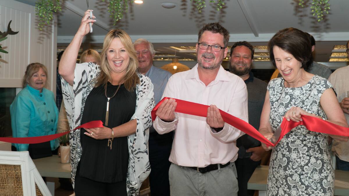 Ready to go: Mayor of  Port Macquarie-Hastings Council, Peta Pinson, officially cuts the ribbon to re-open Whalebone Wharf with owner Nathan Tomkins and Port Macquarie MP Leslie Williams. Photo: Supplied