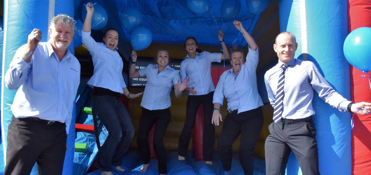 Jumping for joy: Tim Walker, Brooke Cook, Gabby McInherny, Kayla Allen and Vicki Grant and Craig Robinson are pumped up for the Co-op's community party.