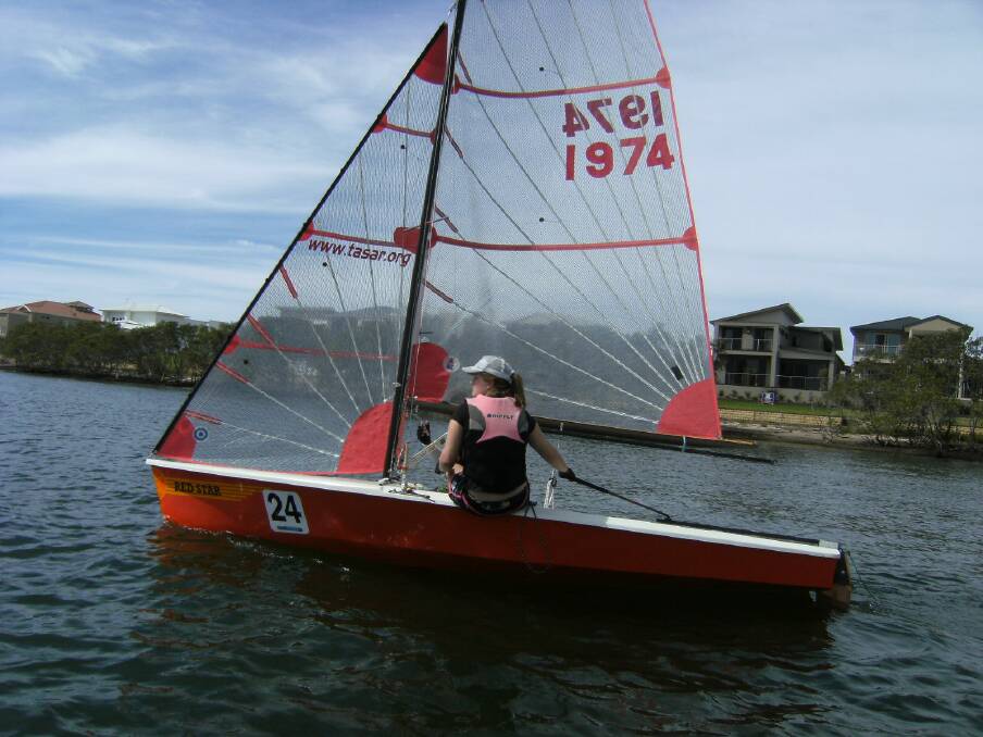 Smooth sailing: Kelly Miller at the  
helm of Red Star in Sunday s race.