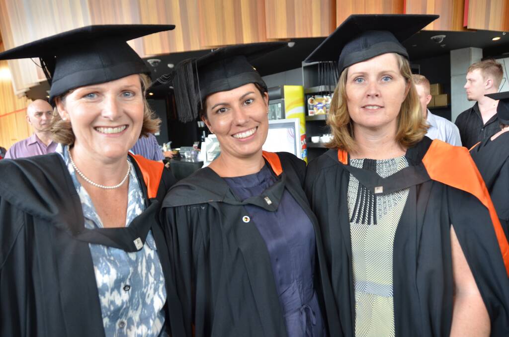 Hats off: Michelle Hogenboom, Erin Lay and Tracy Dillon are graduates from the University of Newcastle's nursing program.