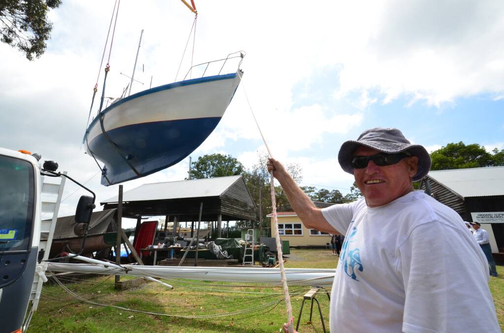 Restoring life: Larry Pullen lauching his restored boat Trusan, which was built in 1967, at the Martime Museum boatyard on the Hastings River.