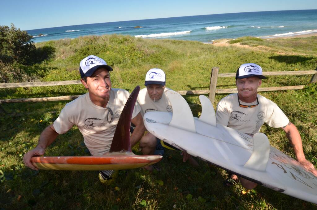 Through the ages: Andy McMahon, Geoff Branch and Michael Campbell gear up for the Bird Rock Memorial with an old retro single-fin and modern three-fin surfboard.