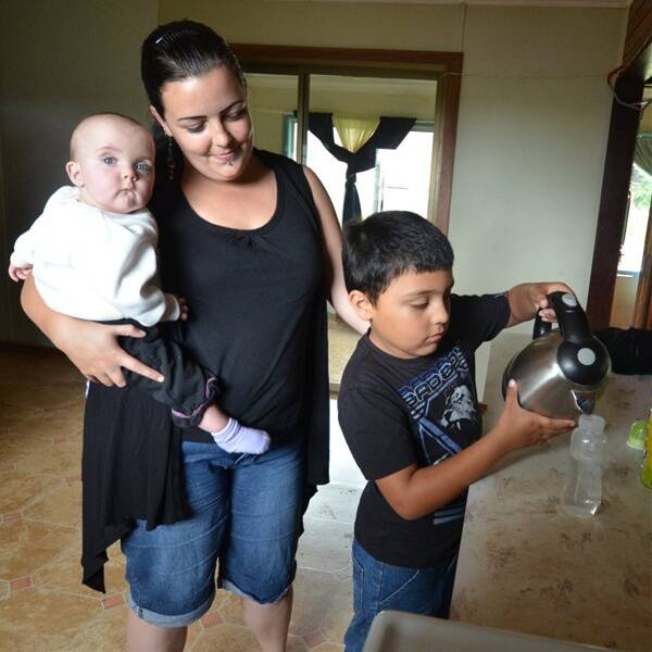 Too hot: Bek Latimore with her children Nick Preece and Arizona Latimore at home in Comboyne.