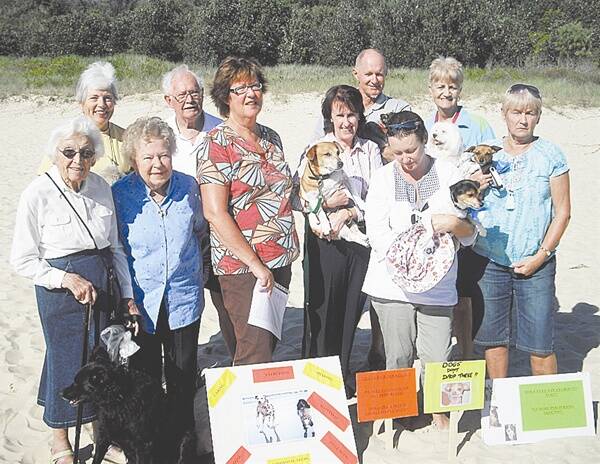 In the dog house: Joan Arthur, Carolyn Blomfield, Daphne Johnston, Ron Shewring, Kathy Broadbent, Leslie Williams, Merv Christensen, Louise Coles, Faye Rowles and Jane Christensen don't want their dogs banned from Wash House Beach.