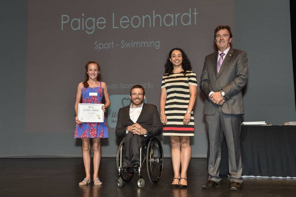 Awarded: Paige Leonhardt, paralympian Kurt Fearnley, Gloria Jeans Coffee representative, Nicole Saleh, and Variety chairman Paul Mullaly on stage.
