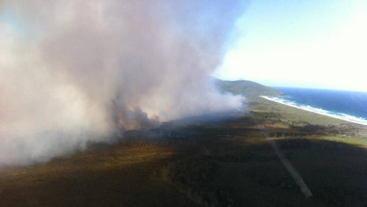 Smoke from the Janies Corner bush fire, near Forster in NSW. Photo: NSW RFS