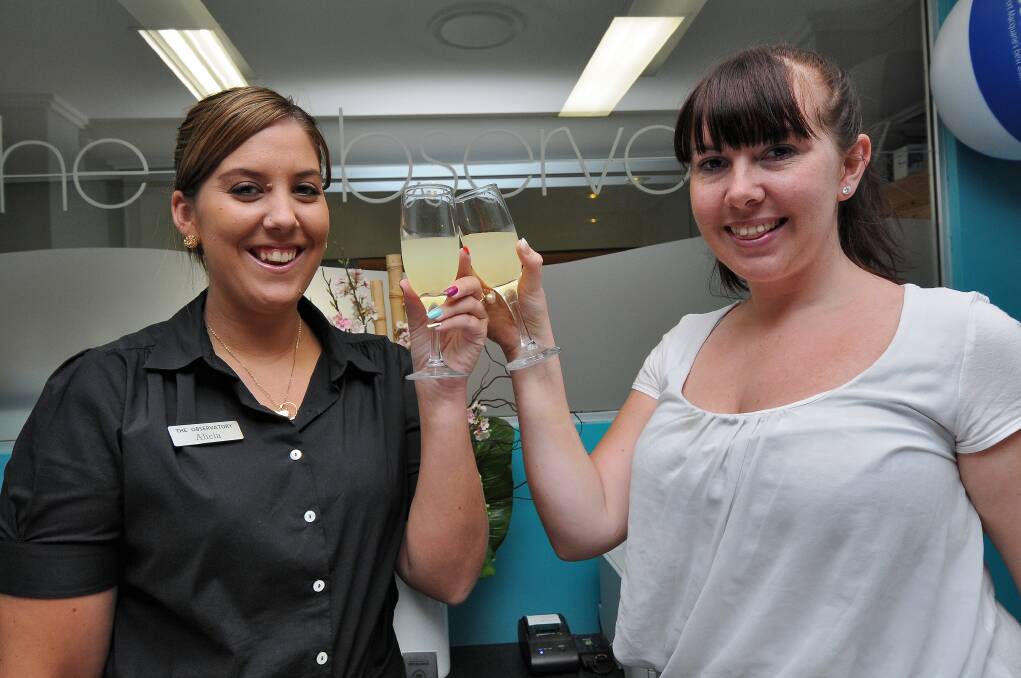 Cheers: Alicia Mowatt and Stephanie McDade from The Observatory toast Friday night’s medal win.