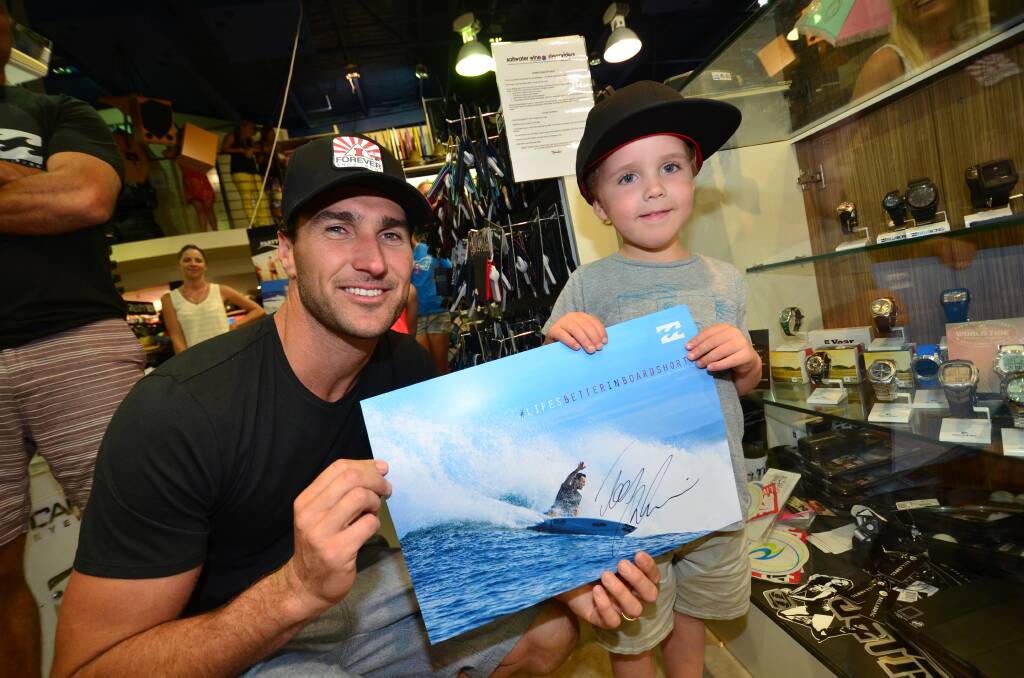 Young surfing fan Jordy Bricknell catches up with surfing world title aspirant Joel Parkinson in Port Macquarie at the weekend.