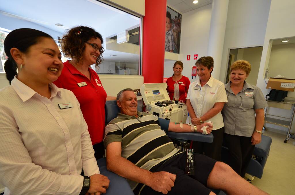 Life saving service: Bob Munro donates blood as Port Macquarie Blood Service Donor Centre manager Jarna Findlay, community relations officer Carrie Skinner, registered nurse Penny Cheetan, donor service nursing assistant Louise Harris and registered nurse Karen Goodland look on.