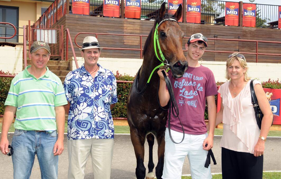 Trainer Wayne Wilkes with Al Hudson, Joel Wilkes and Lisa Wilkes at the Port Macquarie track yesterday.