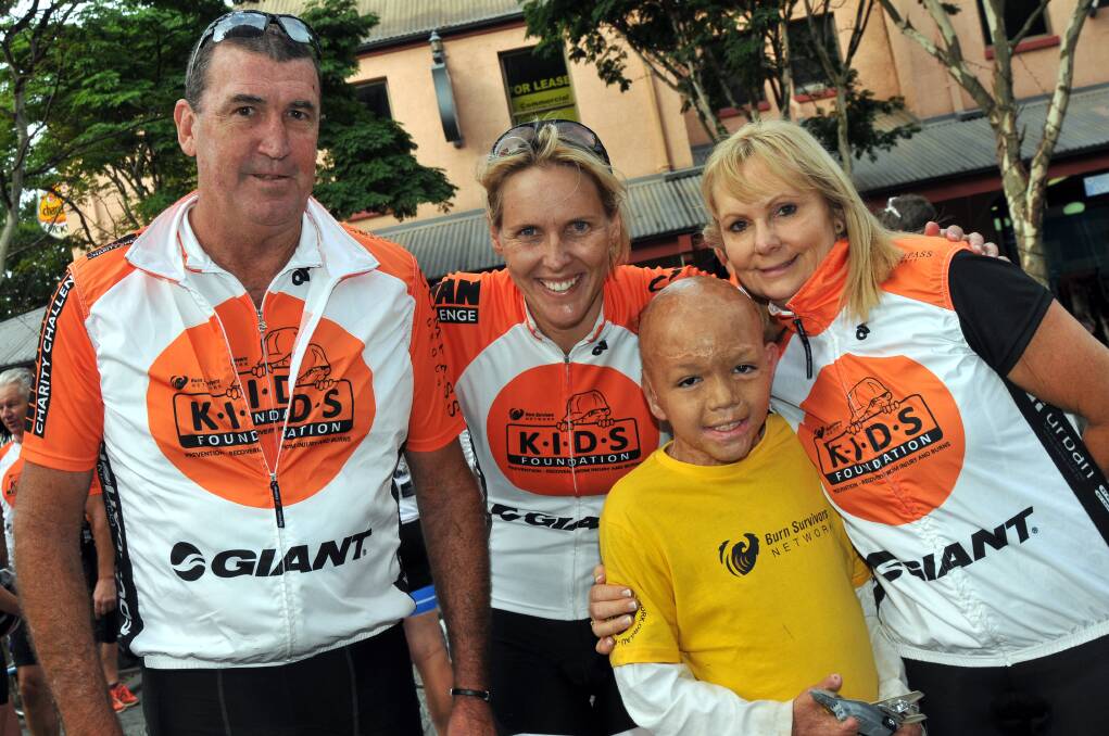 Ride to Port co-founder Brad Foster with Olympian Susie O'Neill and Brock Howes with KIDS Foundation CEO Susie O'Neill.