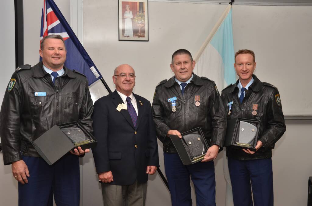 Recognised: Senior Constable Chris Rowley, former Rotary District Governor and president of Port Macquarie West Barry Hacker, Detective Senior Constable Dean Rutledge and Senior Constable Jason Bentley.