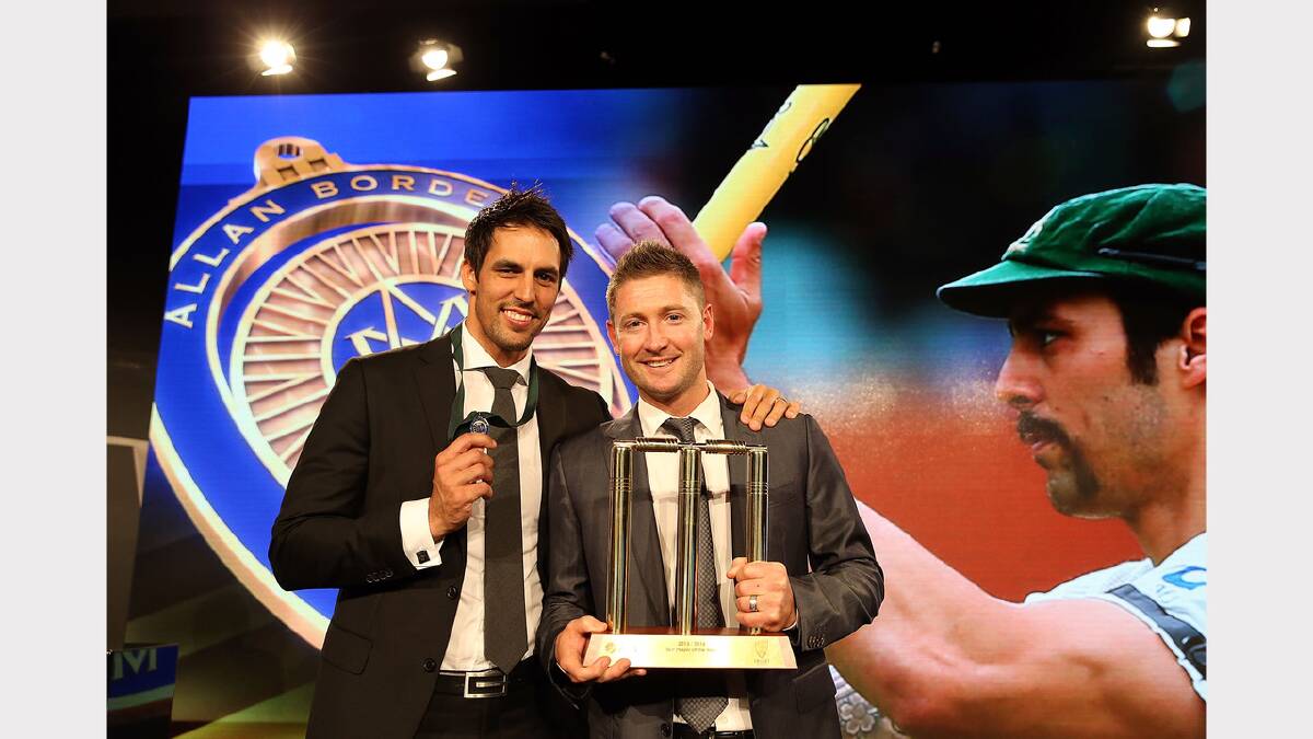 Mitchell Johnson poses with Michael Clarke after winning the Allan Border Medal on Monday night. Picture GETTY IMAGES