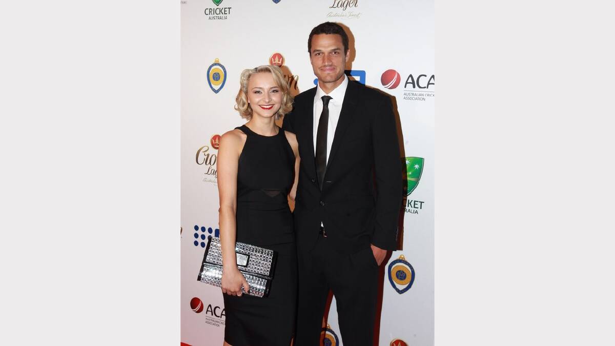  Nathan Coulter-Nile and Ruby Osman-Mulraney arrive at the 2014 Allan Border Medal on Monday night. Picture: Ben Rushton 