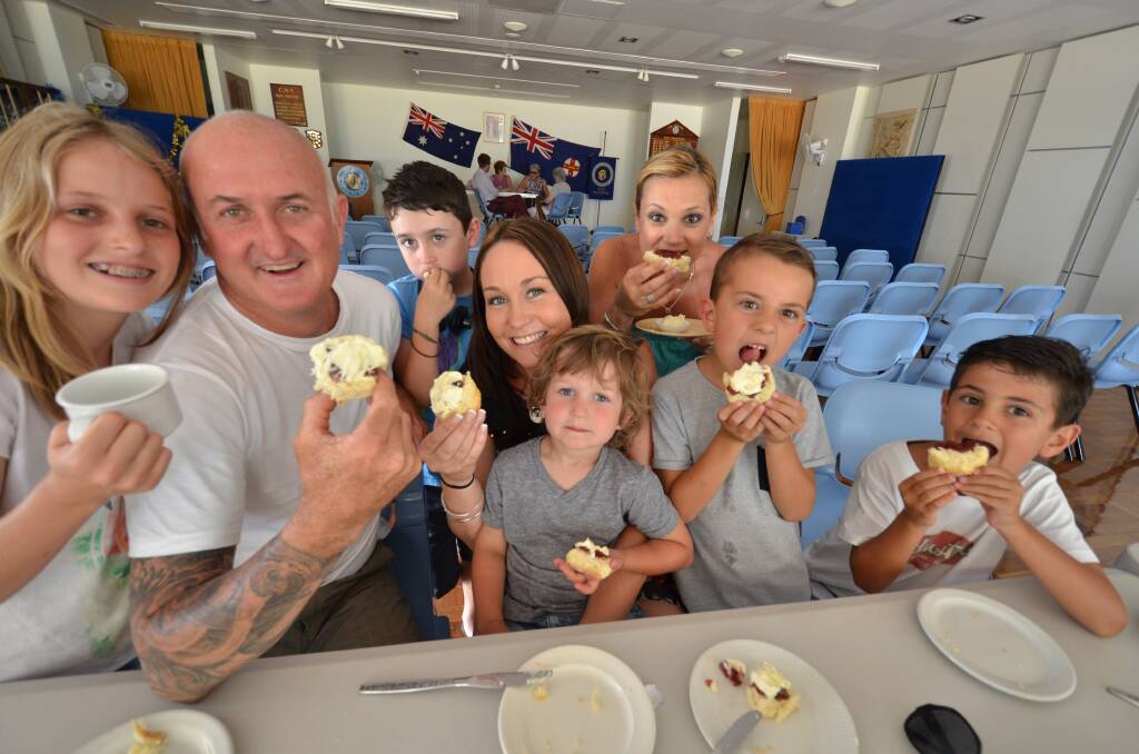 Feeding frenzy: Any time is a good time for a CWA scone according to (from left) Indra, Matt, Banjo, Gabrielle and Archie Stewart, who are enjoying the fine fare with (back) Leesa, Mason and Jett Bezzina from Castle Hill.