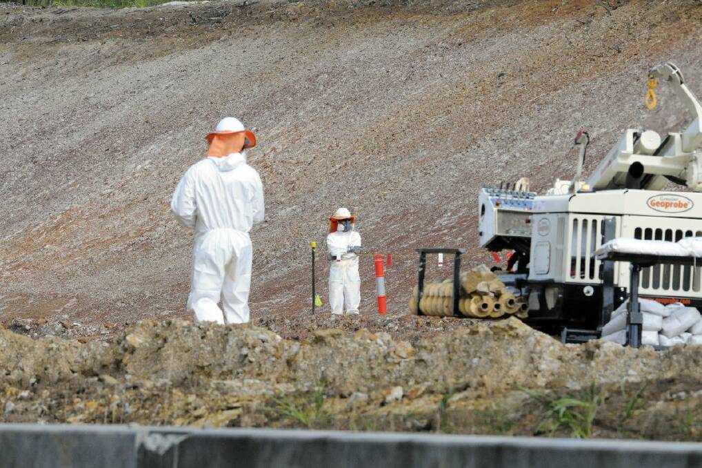 The situation at Herons Creek and the contaminated soil. A quick photo of the soil testers before a security guard told us to move on. Pic: PETER GLEESON