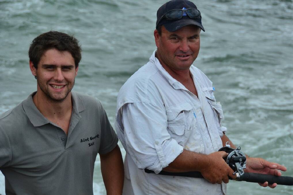 Quieter day: James Connelly and Paul Wicks who caught a grey nurse shark while fishing off the Breakwall at Town Beach on Tuesday which led to some amazing video footage.  Pic NIGEL McNEIL