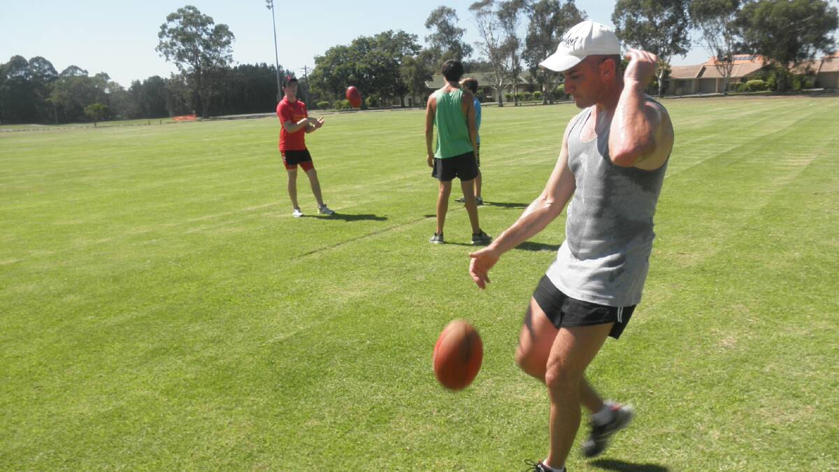Bombers away: Senior Camden Haven Bomber, Paul Mance, gets some kicking practice in before training at Laurieton. The Bombers are training on Mondays and Wednesdays from 5.15pm in preparation for a big year.
