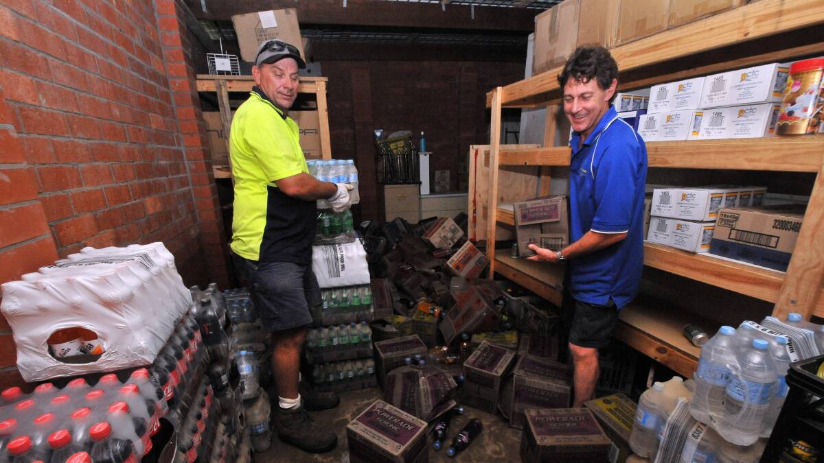 Getting stuck in: Peter Lowe and Daryl Fletcher clean up the Port touch clubhouse.  Pic: PETER GLEESON