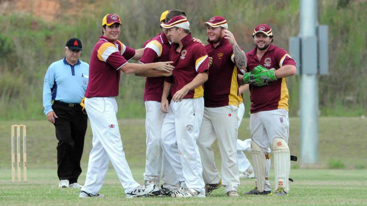 High fives: Macquarie Hotel celebrates a wicket. Pic: PETER GLEESON