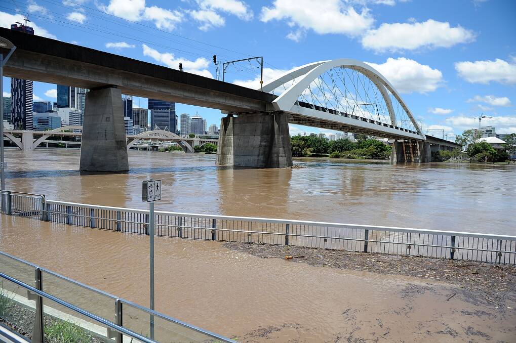 Houses and businesses are flooded as parts of southern Queensland experiences record flooding in the wake of Tropical Cyclone Oswald. Photo: Photo by Chris Hyde/Getty Images