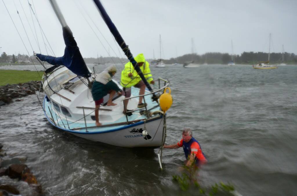 Marine Rescue salvaging a yacht that broke its mooring and washed up at Westport Park. Pic Nigel McNeil