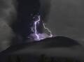 Mount Ibu volcano erupted on Saturday night as streaks of purple lightning flashed around its crater (EPA PHOTO)