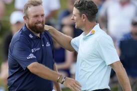 Justin Rose (right) congratulates Shane Lowry on his record-equalling round of 62 at Valhalla. (AP PHOTO)