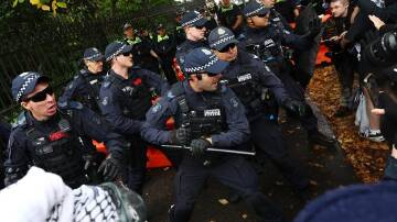 Police have clashed with pro-Palestine protesters in front of Victoria's parliament. (Con Chronis/AAP PHOTOS)